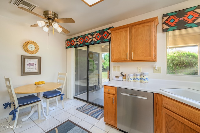 kitchen with ceiling fan, stainless steel dishwasher, and light tile patterned floors