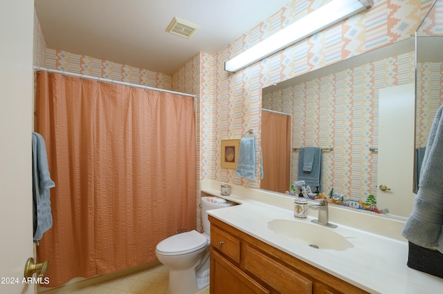 bathroom with vanity, toilet, and walk in shower