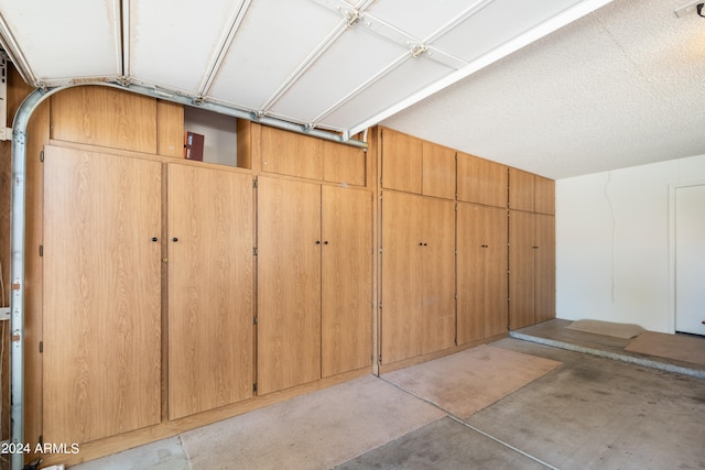 garage featuring wooden walls