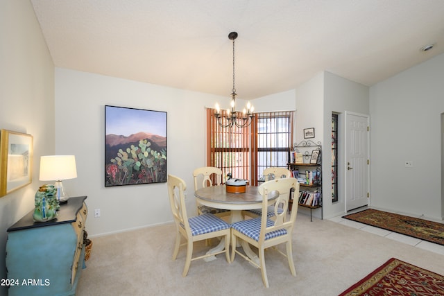 dining area featuring lofted ceiling, an inviting chandelier, and light colored carpet