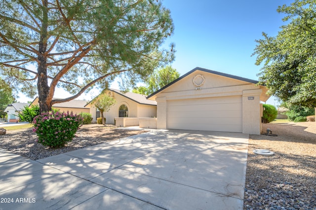 ranch-style house featuring a garage