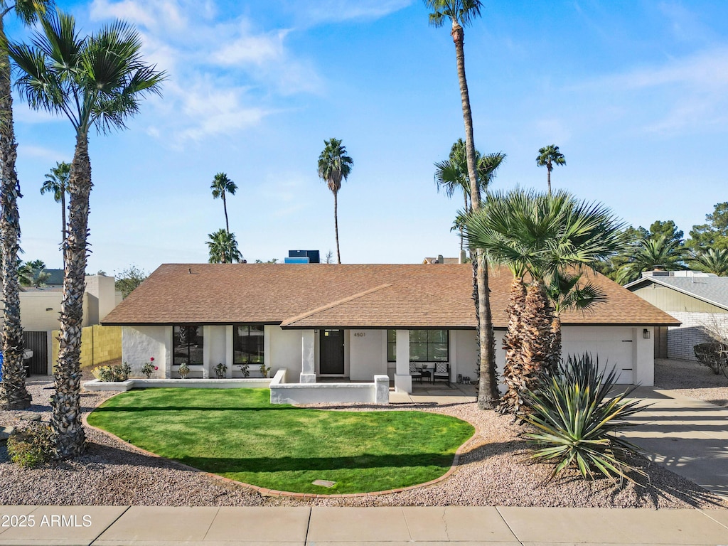 ranch-style home with a front yard