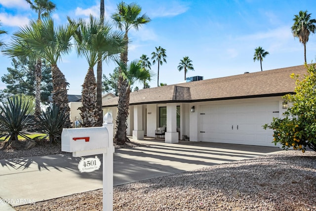 ranch-style home featuring a garage