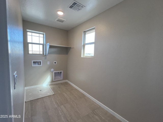 clothes washing area featuring hookup for a washing machine, visible vents, gas dryer hookup, laundry area, and electric dryer hookup