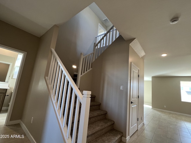 stairs featuring tile patterned flooring, visible vents, recessed lighting, and baseboards