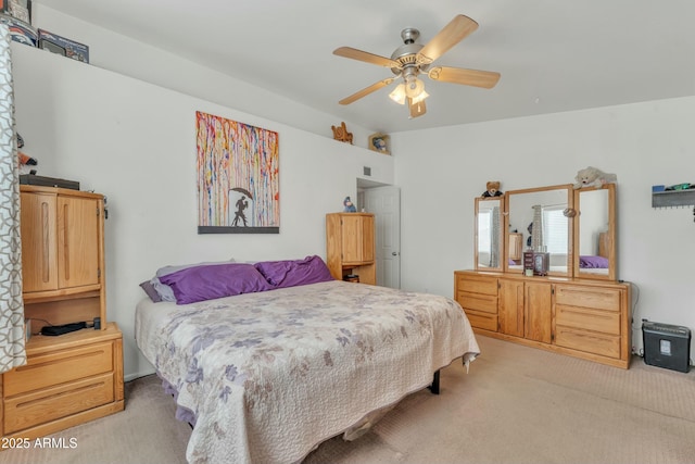 bedroom featuring light colored carpet and ceiling fan