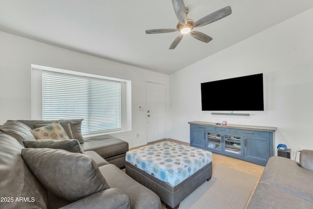 living room with lofted ceiling and ceiling fan