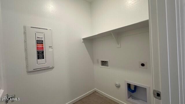 laundry area featuring electric panel, gas dryer hookup, washer hookup, and tile patterned flooring