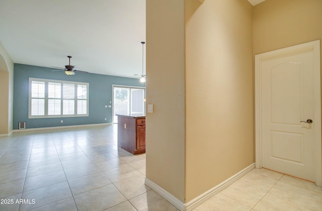 hall featuring light tile patterned flooring