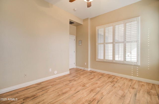 spare room with ceiling fan and light hardwood / wood-style flooring