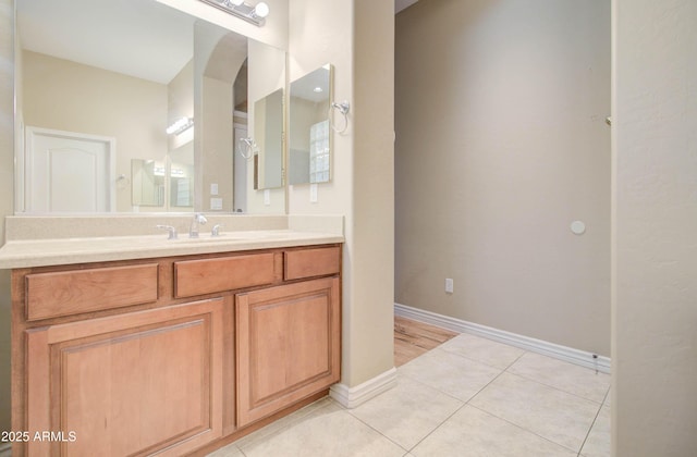 bathroom with tile patterned flooring and vanity