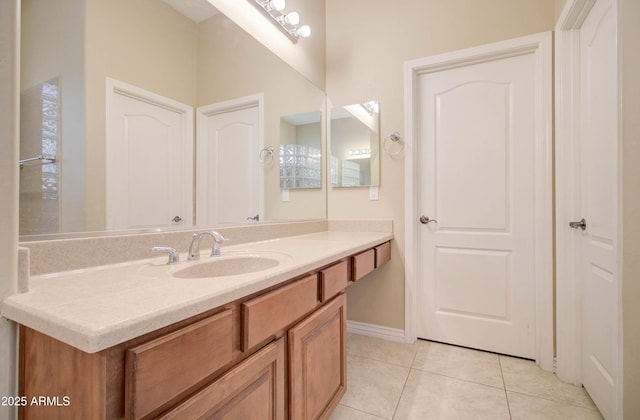 bathroom with vanity and tile patterned floors