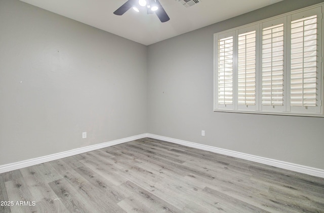 unfurnished room featuring ceiling fan and light hardwood / wood-style floors