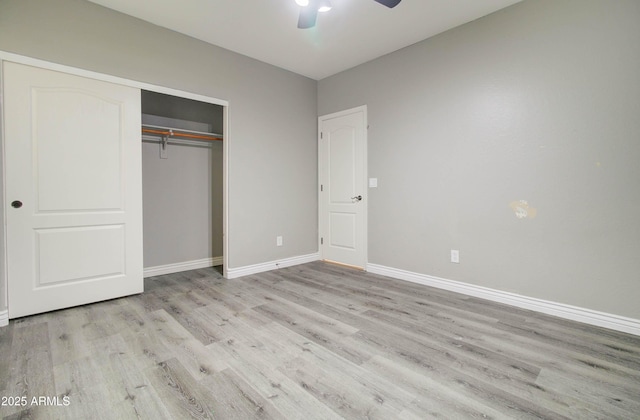 unfurnished bedroom featuring a closet, ceiling fan, and light wood-type flooring