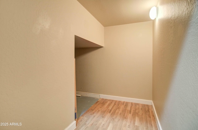 laundry area with hardwood / wood-style floors