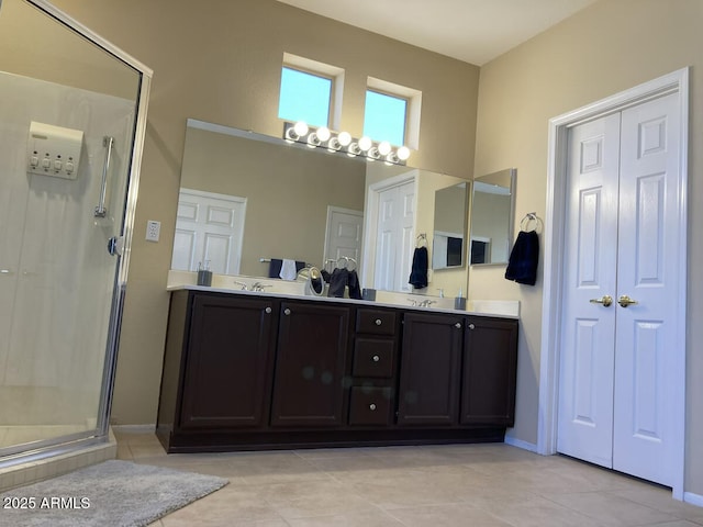 15753 W Kino Dr, Surprise, AZ 85374 - bathroom with a shower stall, tile patterned flooring, and double vanity