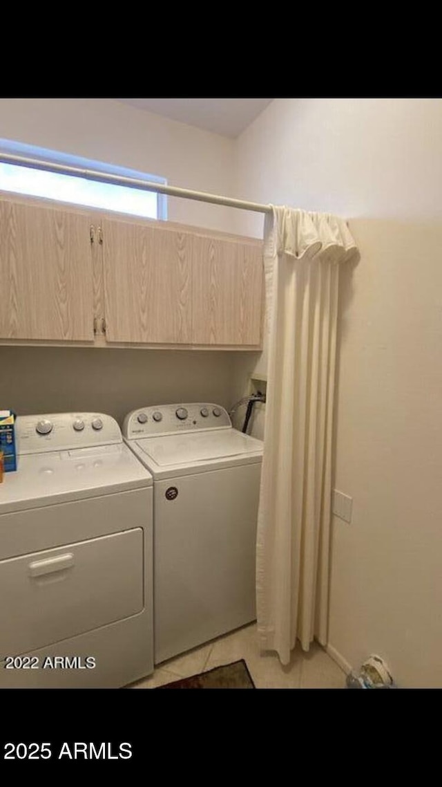 15753 W Kino Dr, Surprise, AZ 85374 - laundry room featuring independent washer and dryer, cabinet space, and light tile patterned floors