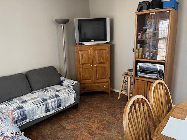 living room featuring baseboards