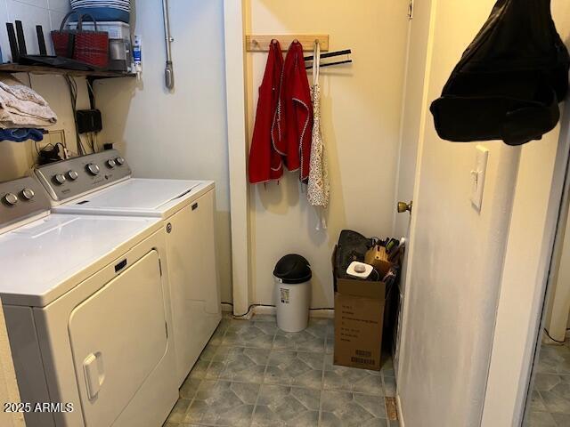 laundry area featuring washer and dryer and laundry area