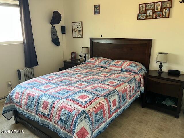 bedroom with radiator heating unit