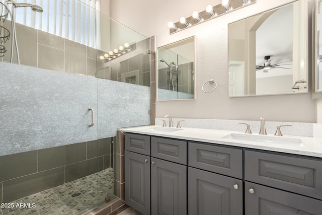 723 N Joshua Tree Ln, Gilbert, AZ 85234 - full bath featuring double vanity, a shower stall, and a ceiling fan