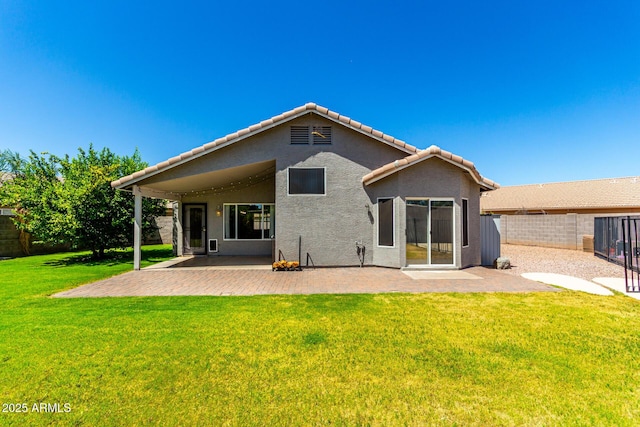 723 N Joshua Tree Ln, Gilbert, AZ 85234 - back of house with a patio, stucco siding, a fenced backyard, and a tiled roof