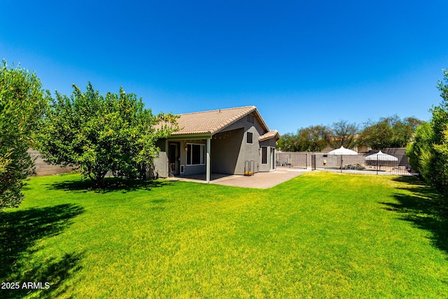 723 N Joshua Tree Ln, Gilbert, AZ 85234 - back of house featuring a tiled roof, a patio, and stucco siding