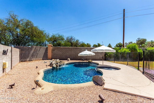 723 N Joshua Tree Ln, Gilbert, AZ 85234 - view of pool featuring a fenced backyard, a patio area, and a pool with connected hot tub