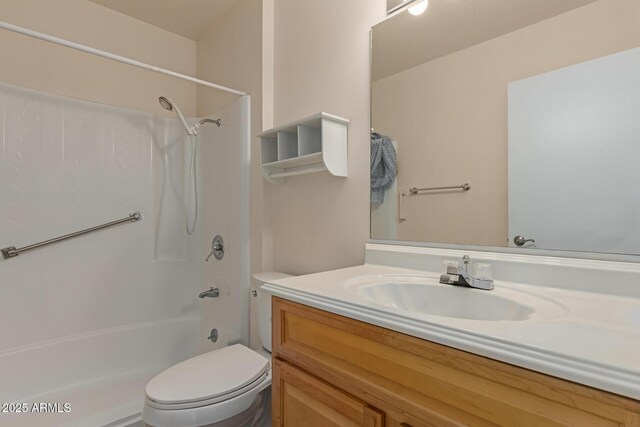 bathroom with shower / bathtub combination, toilet, and vanity