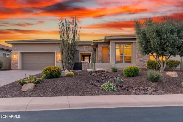 prairie-style home featuring a garage