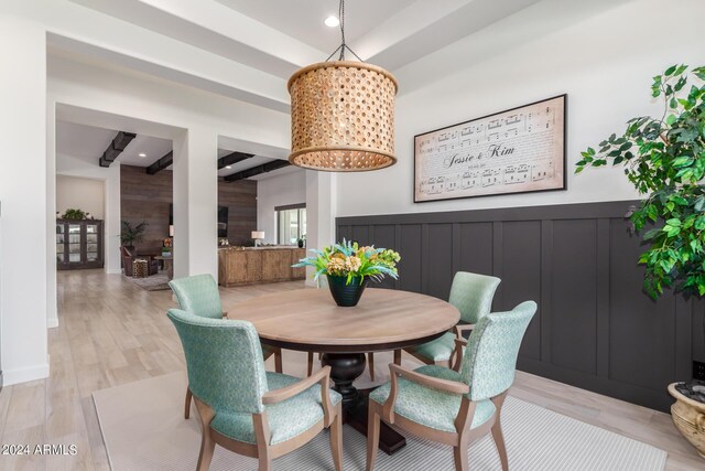 dining space featuring a chandelier and light wood-type flooring