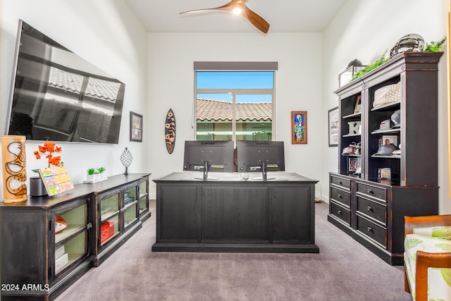 carpeted home office with ceiling fan