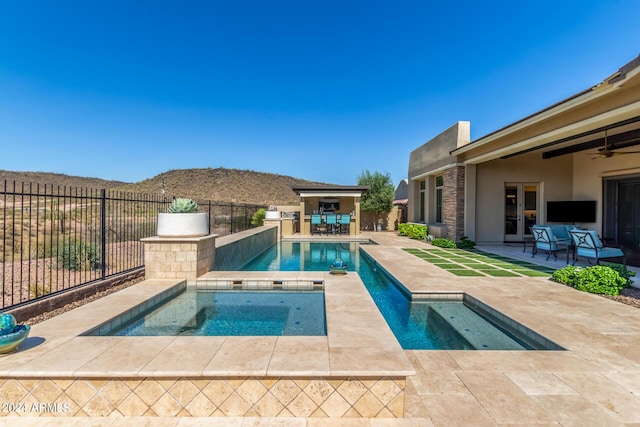 view of swimming pool featuring a patio, an in ground hot tub, french doors, and ceiling fan