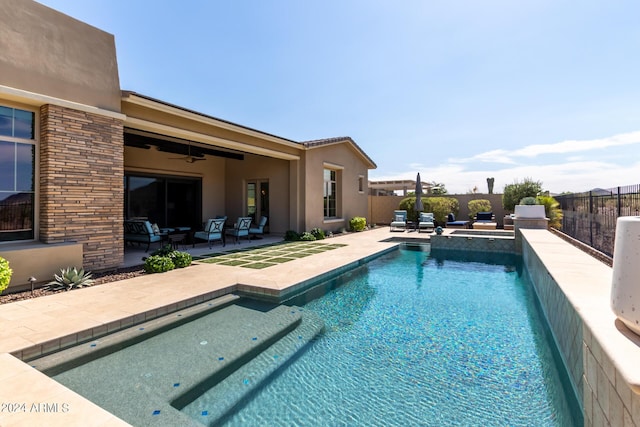 view of pool with ceiling fan and a patio area