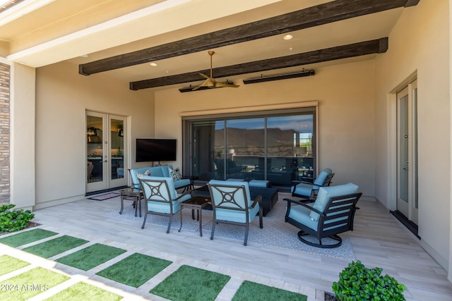 view of patio with an outdoor living space and french doors