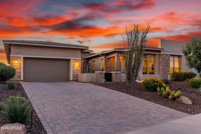 prairie-style home featuring a garage