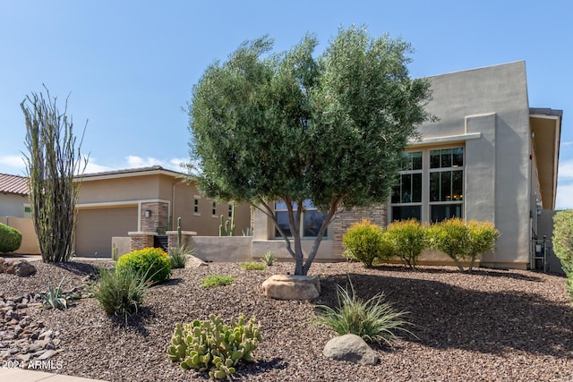 view of front of property with a garage