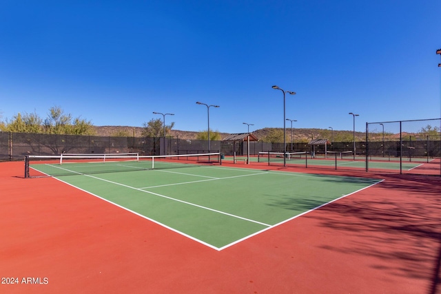 view of sport court with basketball hoop