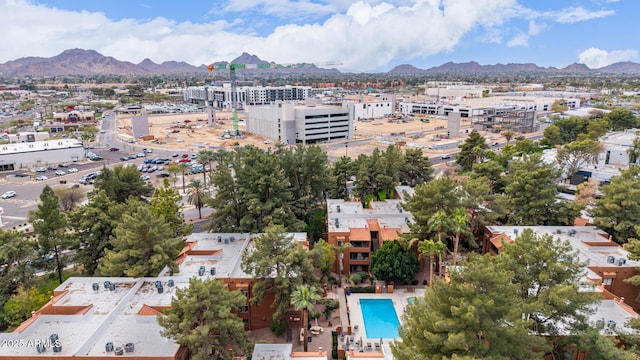 birds eye view of property featuring a mountain view