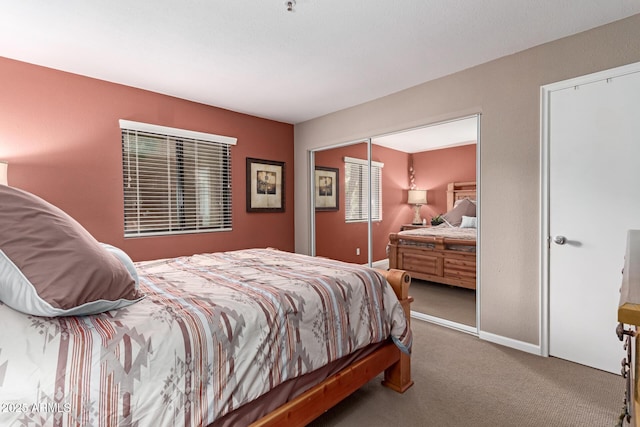 bedroom with carpet floors and baseboards