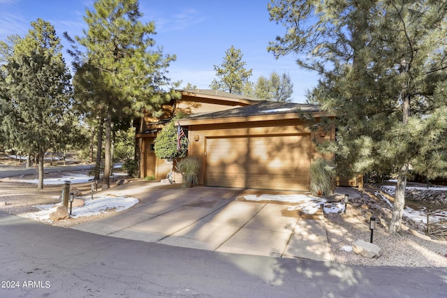 view of front of property with a garage and driveway