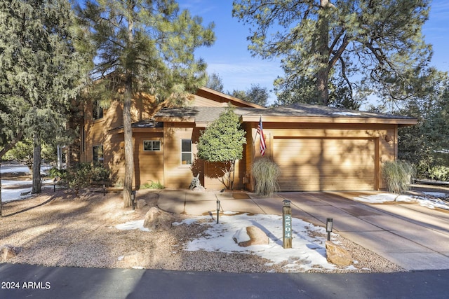 view of front of property featuring an attached garage and driveway