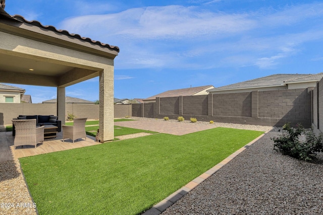 view of yard with a patio and outdoor lounge area