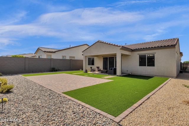 rear view of property featuring a patio area, a lawn, and central AC unit