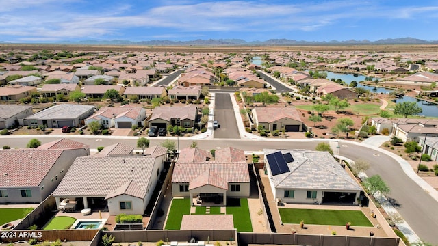 bird's eye view featuring a water and mountain view