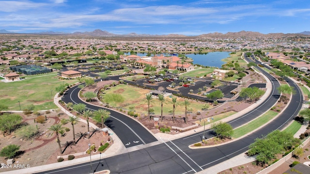 drone / aerial view featuring a water and mountain view