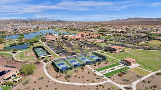 drone / aerial view featuring a water and mountain view