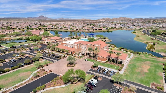 birds eye view of property with a water and mountain view