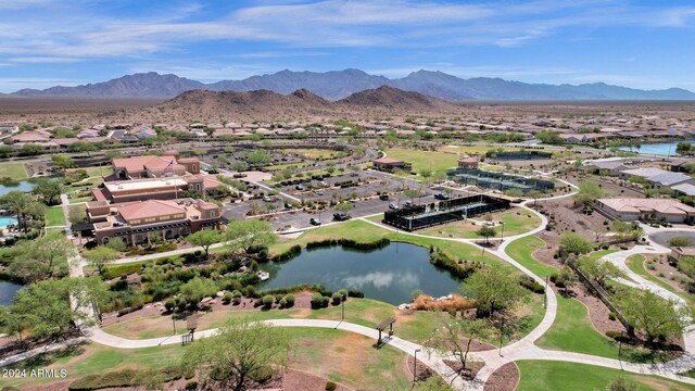 bird's eye view with a water and mountain view