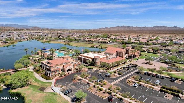 birds eye view of property featuring a water and mountain view